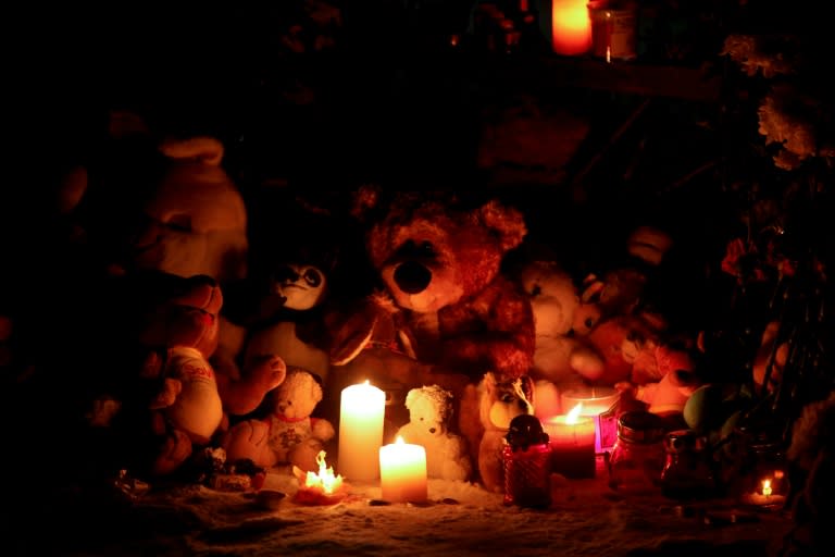 Relatives and supporters set up a makeshift memorial near the site of the deadly gas explosion at an apartment block in the Russian Urals city of Magnitogorsk