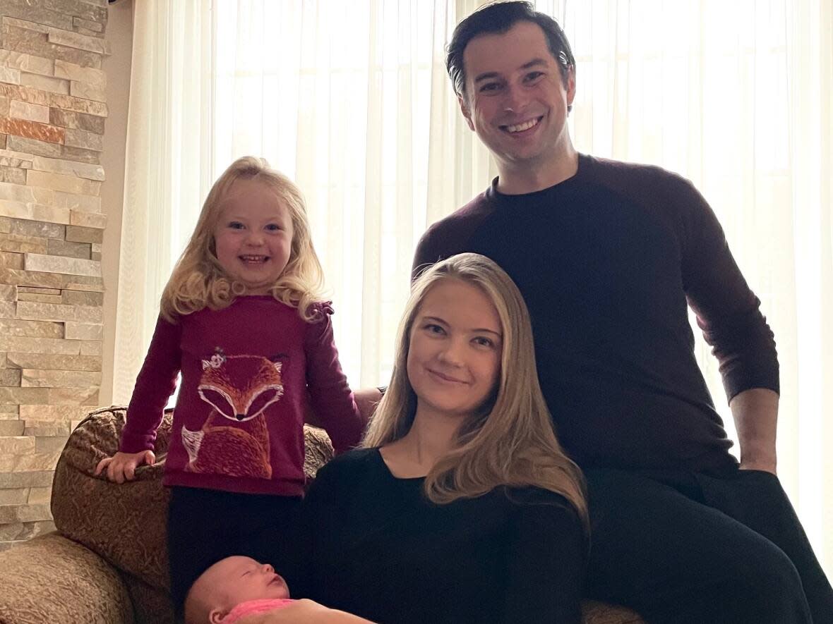  Anastasiya Kaczmarek, 27, pictured here with Miles, daughter Evelina, left, and baby Veronica. She says she has no memory of the couple of days before her cardiac arrest and memory gaps that span the weeks before. (Submitted by Anastasiya Kaczmarek - image credit)