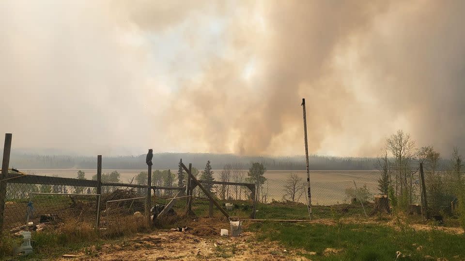 Smoke rises as fire singes Fort Nelson on May 14. - Cheyenne Berreault/Anadolu/Getty Images