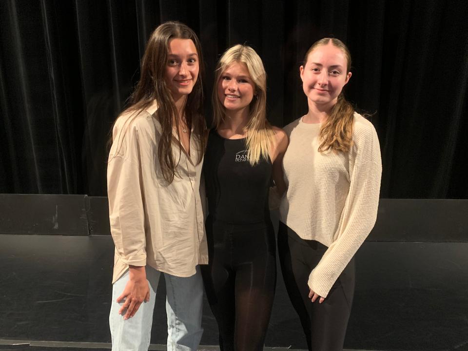 (Left to right) SCVTHS dance students Athena Bernaz of Basking Ridge, Mia Cirafesi of Branchburg, and Caitlin Eswein of Branchburg pose for a photo on the stage at Somerset County Vocational & Technical Schools.