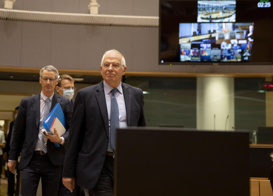 European Union foreign policy chief Josep Borrell, center, arrives for a videoconference meeting between EU foreign ministers and U.S. Secretary of State Mike Pompeo at the European Council building on Monday, June 15, 2020. The talks, which were to focus on China, developments in the Middle East and trans-Atlantic relations, come at a time of simmering tensions between the Brussels and Washington, notably over trade differences and the Iran nuclear agreement. (AP Photo/Virginia Mayo, Pool)