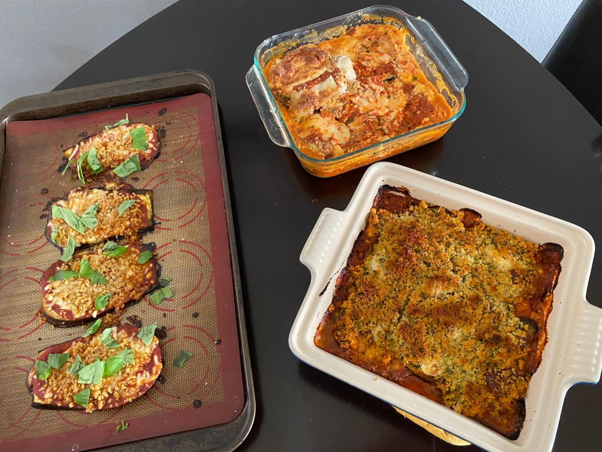 Three versions of eggplant Parmesan laid out on a table.