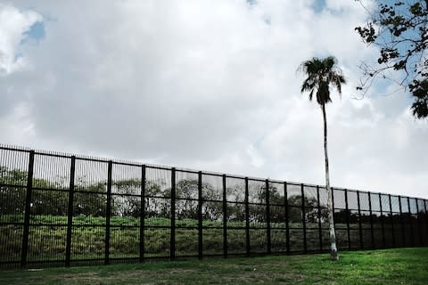 A border fence near Brownsville - Credit: GETTY
