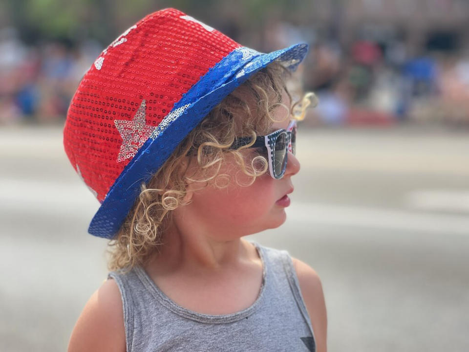 Shawn Cotreau's 2-year-old son, enjoying the parade just minutes before a 21-year-old gunman opened fire, killing seven people and injuring dozens more. (Courtesy Shawn Cotreau)