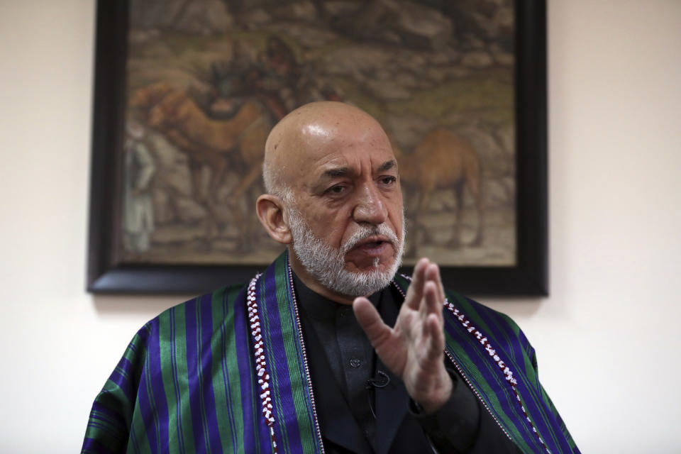 Former Afghan President Hamid Karzai speaks during an interview with the Associated Press in Kabul, Afghanistan, Thursday, March 11, 2021. Afghans are eager for peace and a recently floated U.S. draft for a deal between Taliban insurgents and the Afghan government is the best chance to accelerate stalled peace talks, ex-president Hamid Karzai said in an interview Thursday. (AP Photo/Rahmat Gul)