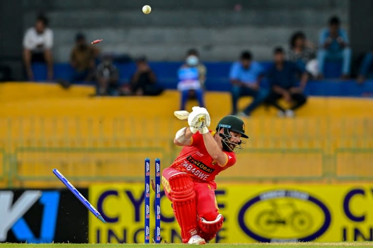 Zimbabwe's Ryan Burl is clean bowled by Sri Lanka's Dushmantha Chameera (Ishara S. KODIKARA)