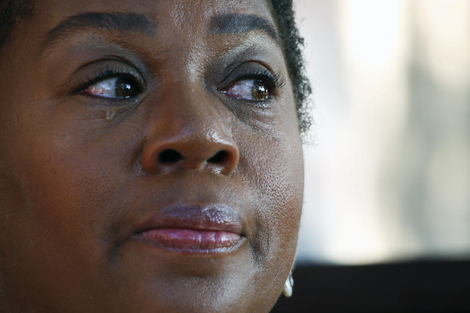 Wanda Vincent sheds a tear on Saturday, Oct. 23, 2021, during an interview at the Mother's Heart Learning Center in Arlington, Texas. Vincent, who owns the day care, is upset about a proposal to add natural gas wells at a nearby fracking site that's operated by TEP Barnett, a subsidiary of French energy giant Total Energies. The proposal, which was rejected last year during nationwide Black Lives Matter protests, got initial approval from the city's planning commission in October, despite continued opposition from Vincent, parents and residents in the neighborhood. They worry about long- and short-term impacts of drilling, particularly on the children in the community. (AP Photo/Martha Irvine)