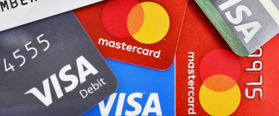 Close up of many VISA and MASTER credit card background with new logo