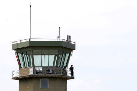 An Albanian military member is pictured at the air traffic control tower in Kucova Air Base in Kucova, Albania, October 3, 2018. REUTERS/Florion Goga