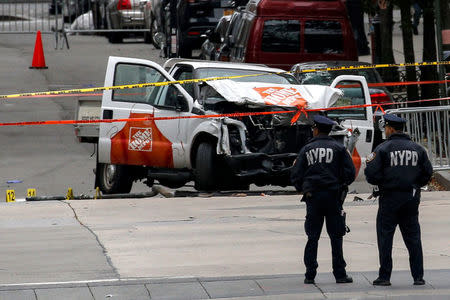 Police investigate a pickup truck used in an attack on the West Side Highway in lower Manhattan in New York City, U.S., November 1, 2017.REUTERS/Brendan McDermid