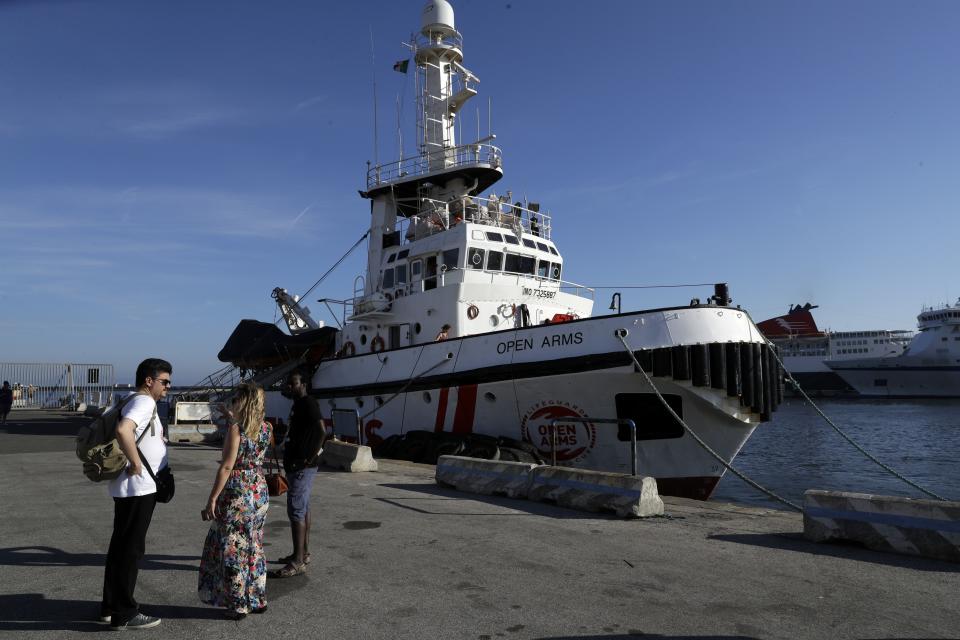 The Open Arms ship is moored at the Naples harbor, Italy, Thursday, June 20,2 019. The Spanish NGO migrant ship Open Arms is in Naples with activists speaking to media and the public to mark World Refugee Day. (AP Photo/Andrew Medichini)