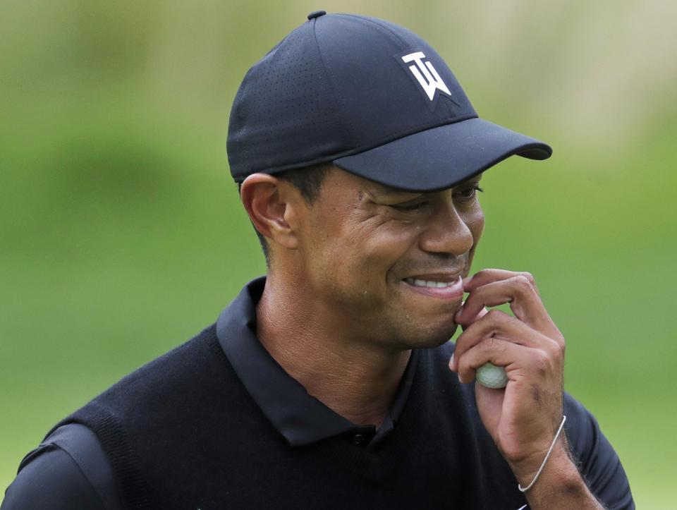 Tiger Woods reacts as he walks off the 7th green during the second round of the PGA Championship golf tournament, Friday, May 17, 2019, at Bethpage Black in Farmingdale, N.Y. (AP Photo/Julio Cortez)