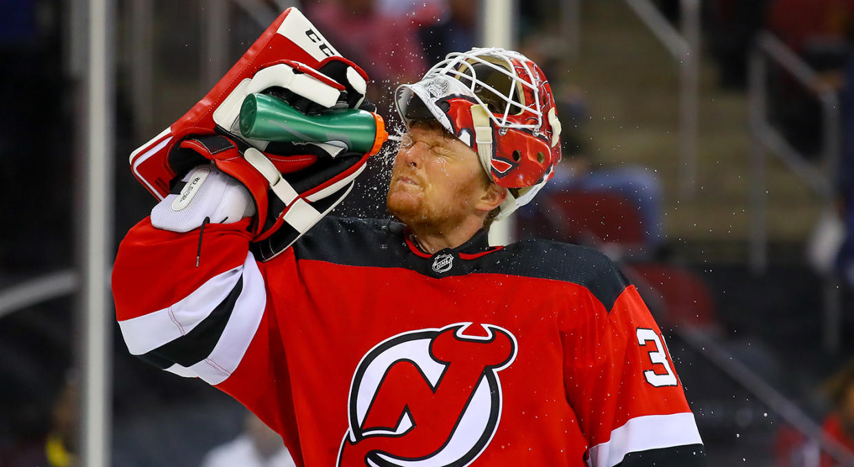 NEWARK, NJ - OCTOBER 14:  New Jersey Devils goaltender Cory Schneider (35) sprays water on his face during the third period of the National Hockey League game between the New Jersey Devils and the Florida Panthers on October 14, 2019 at the Prudential Center in Newark, NJ.  (Photo by Rich Graessle/Icon Sportswire via Getty Images)