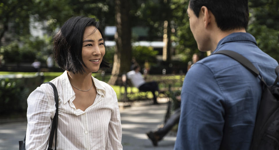 This image released by A24 shows Greta Lee, left, and Teo Yoo in a scene from "Past Lives." (Jon Pack/A24 via AP)