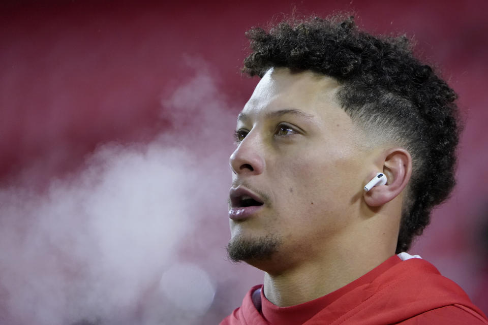 Kansas City Chiefs quarterback Patrick Mahomes warms up on the field before the team's NFL wild-card playoff football game against the Miami Dolphins on Saturday, Jan. 13, 2024, in Kansas City, Mo. (AP Photo/Ed Zurga)