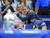 Runner-up Roberta Vinci of Italy (L) talks with compatriot and tournament winner Flavia Pennetta following their women's singles final match at the U.S. Open Championships tennis tournament in New York, September 12, 2015. REUTERS/Eduardo Munoz