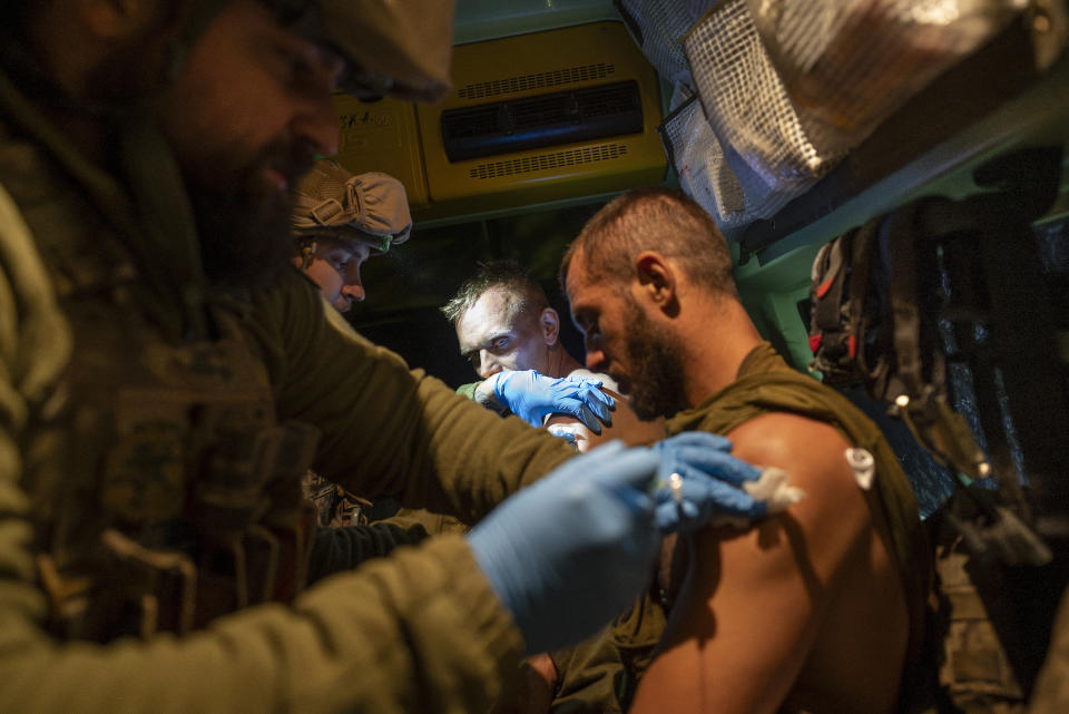 Ukrainian paramedics of 3rd Assault brigade evacuate wounded soldiers near Bakhmut, Donetsk region, Ukraine, Sunday, Sept. 10, 2023. When Ukrainian soldiers finally reclaimed Andriivka last week, it was at a high cost in lives. The village is significant largely because it's on the road to the Russian-held city of Bakhmut. (AP Photo/Mstyslav Chernov)