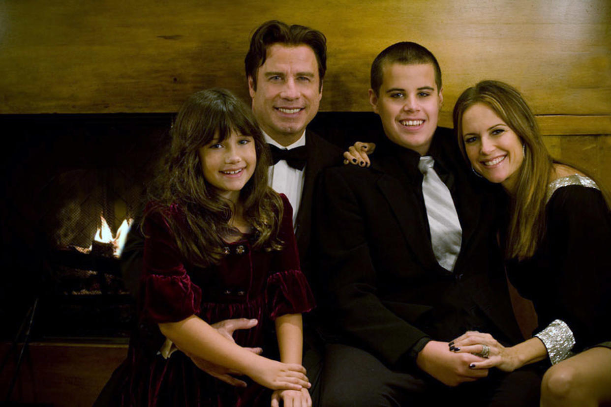 John Travolta (2nd L), his wife Kelly Preston (R) and their children Jett (2nd R) and Ella. (Photo by Rogers and Cowan via Getty Images)