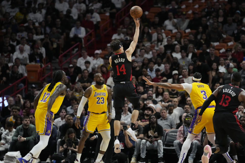 Miami Heat guard Tyler Herro (14) shoots during the first half of an NBA basketball game against the Los Angeles Lakers, Monday, Nov. 6, 2023, in Miami. (AP Photo/Lynne Sladky)