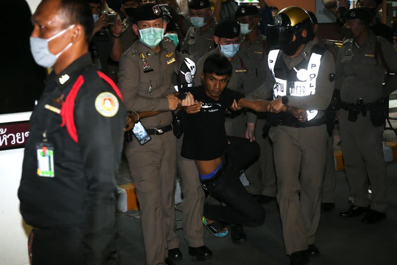Panupong Jadnok, a pro-democracy student, one of the leaders of Thailand's recent anti-government protests, is pictured after being detained, and being transfer to the criminal court in Bangkok