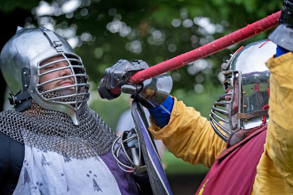 Members of Barony of Sternfeld, Paul Brown (Paul of Beckenham), left, and Brian Knight (Odo von Atzinger) give a demonstration to others practicing armored combat at Washington Township Park, Tuesday, Aug. 9, 2022 in Avon. The local chapter of the international Society of Creative Anachronism gathers for practice weekly when not off participating in activity around the country. 