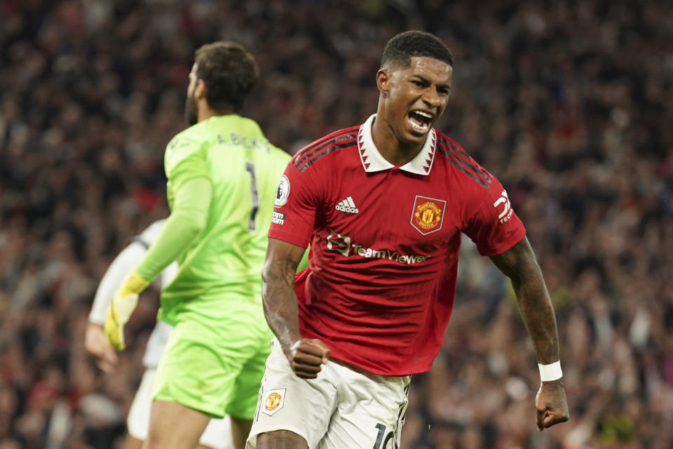 Manchester United's Marcus Rashford celebrates after scoring his side's second goal during the English Premier League soccer match between Manchester United and Liverpool at Old Trafford stadium, in Manchester, England, Monday, Aug 22, 2022. (AP Photo/Dave Thompson)