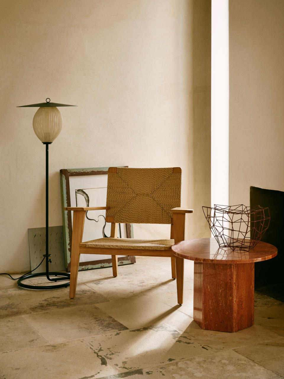 Red travertine table by GUBI