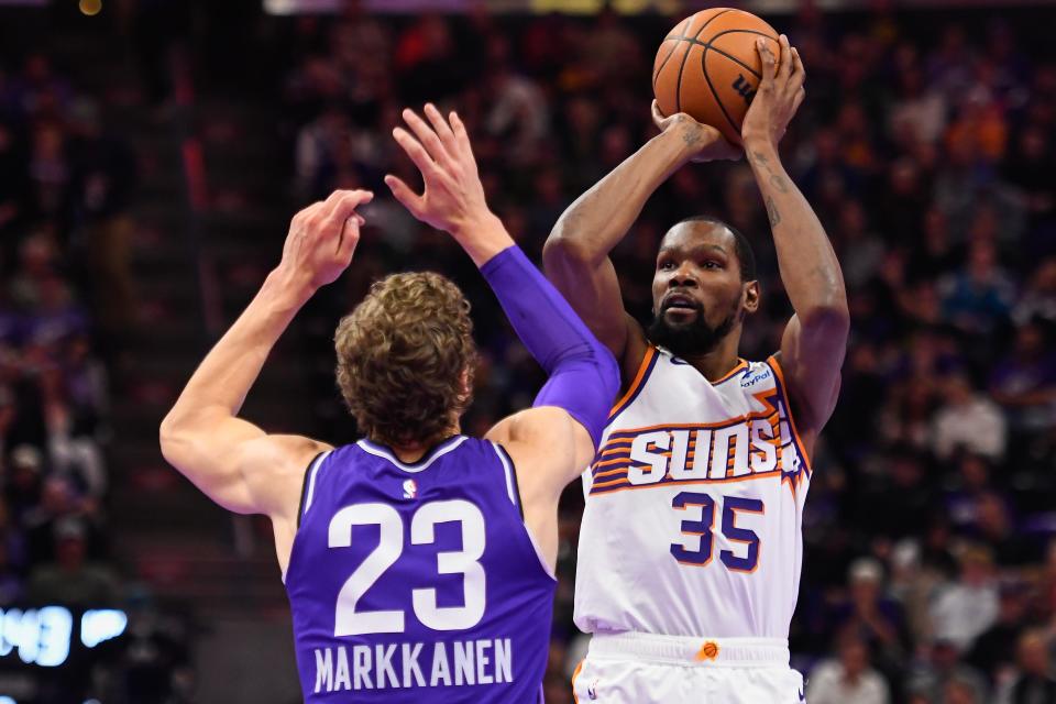 Kevin Durant #35 of the Phoenix Suns shoots over Lauri Markkanen #23 of the Utah Jazz during the first half of an NBA In-Season Tournament game at Delta Center on Nov. 17, 2023, in Salt Lake City, Utah.