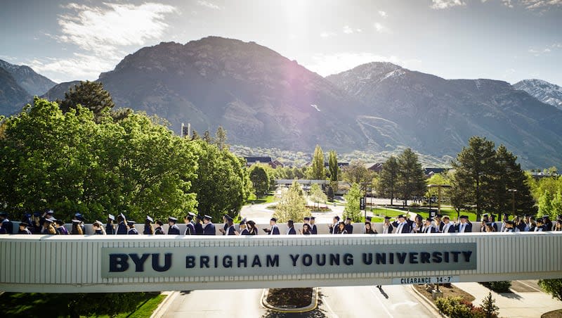 Graduates line up for processional prior to BYU commencement exercises held in the Marriott Center in Provo, Utah, on Thursday, April 25, 2024.
