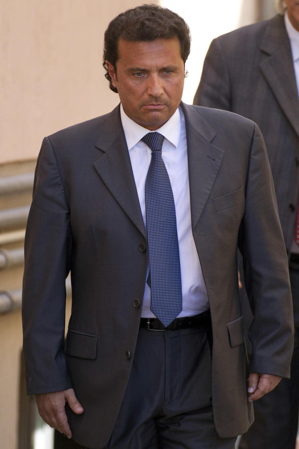FILE -- In this file photo taken in Grosseto on April 15 2013, former captain of the Costa Concordia luxury cruise ship Francesco Schettino leaves after a closed-door hearing. The Italian captain of the Costa Concordia cruise ship was ordered on Wednesday to stand trial for manslaughter in the luxury liner's shipwreck off the coast of Tuscany, which killed 32 people. Judge Pietro Molino, at a closed door hearing in the town of Grosseto, agreed to prosecutors' requests that Francesco Schettino should be tried on charges of manslaughter, causing the shipwreck and abandoning the vessel while many of the 4,200 passengers and crew were still aboard. (AP Photo/Andrew Medichini)