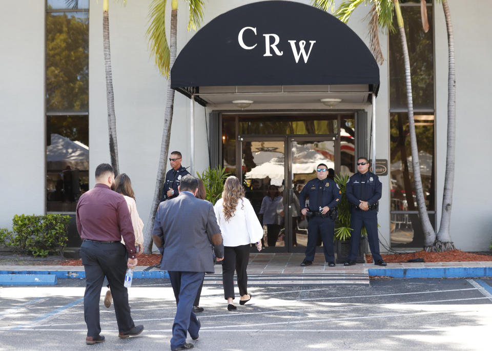 Mourners arrive at the wake for the late Mexican singer Jose Jose, Friday, Oct. 4, 2019, in Miami. The singer, beloved for his melancholy ballads, died last Saturday in Miami at age 71. (AP Photo/Wilfredo Lee)