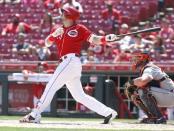 Jun 20, 2018; Cincinnati, OH, USA; Cincinnati Reds left fielder Adam Duvall hits a solo home run against the Detroit Tigers during the eighth inning at Great American Ball Park. Mandatory Credit: David Kohl-USA TODAY Sports