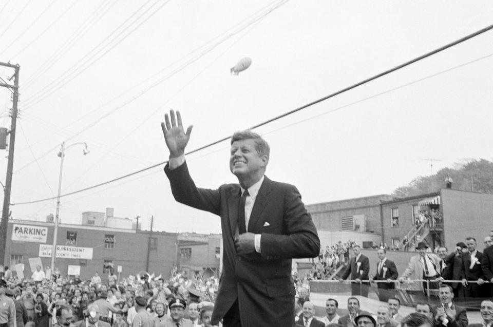 President John F. Kennedy waves during a congressional campaign rally in Aliquippa, Pennsylvania on Ocrtober 12, 1962. (Cecil Stoughton/The White House via JFK Library)