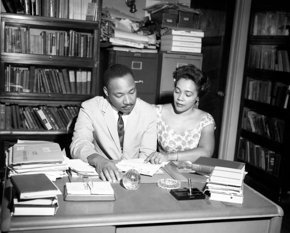 Martin Luther King Jr. and his wife Coretta Scott King work in his office in Atlanta in July 1962. <a href="https://www.gettyimages.com/detail/news-photo/american-baptist-minister-and-activist-martin-luther-king-news-photo/1470078983?phrase=coretta%20scott%20king&adppopup=true" rel="nofollow noopener" target="_blank" data-ylk="slk:TPLP/Archive Photos via Getty Images;elm:context_link;itc:0;sec:content-canvas" class="link ">TPLP/Archive Photos via Getty Images</a>