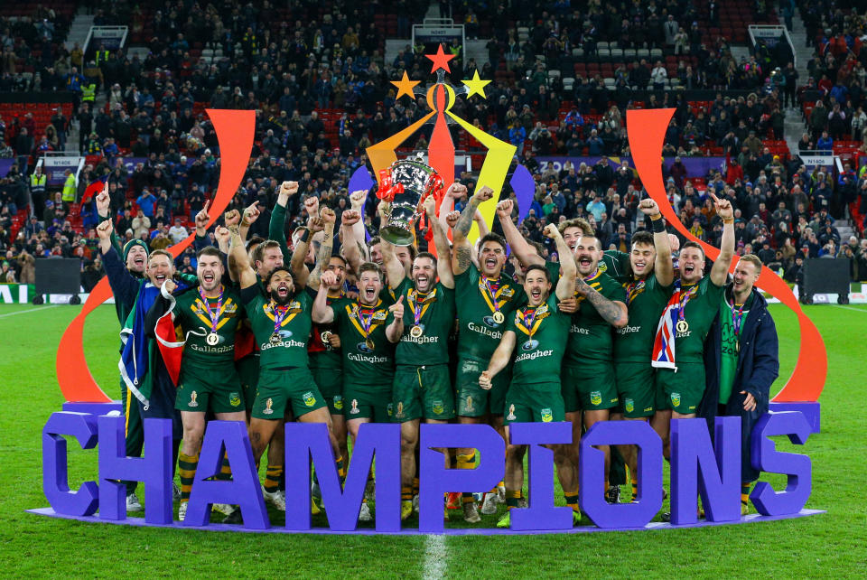 Australian players, pictured here celebrating with the trophy after winning the Rugby League World Cup.