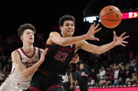 Stanford forward Brandon Angel, right, takes an inbound pass as Southern California guard Drew Peterson defends during the second half of an NCAA college basketball game Thursday, Jan. 27, 2022, in Los Angeles. (AP Photo/Mark J. Terrill)