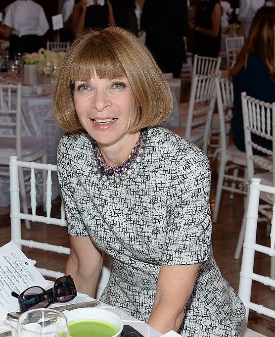 Anna Wintour sitting in a restaurant