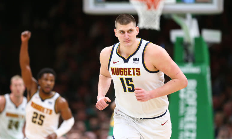 Nikola Jokic running up the court during a game.