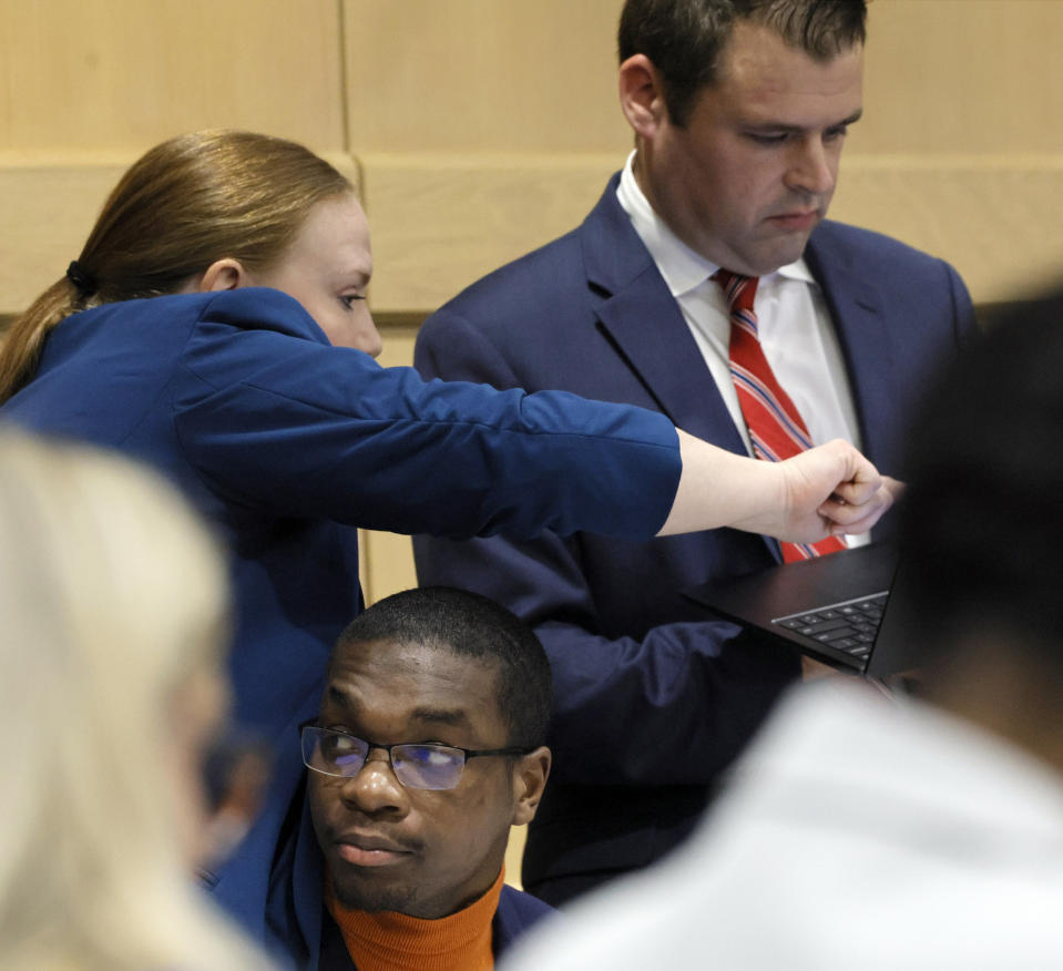 Attorneys Skyler Hill, left, and Joseph Kimok confer as shooting suspect Michael Boatwright is shown at the defense table just before opening statements in the XXXTentacion murder trial at the Broward County Courthouse in Fort Lauderdale, Fla., on Tuesday, Feb. 7, 2023. Emerging rapper XXXTentacion, born Jahseh Onfroy, 20, was killed during a robbery outside of Riva Motorsports in Pompano Beach in 2018. (Amy Beth Bennett/South Florida Sun-Sentinel via AP, Pool)