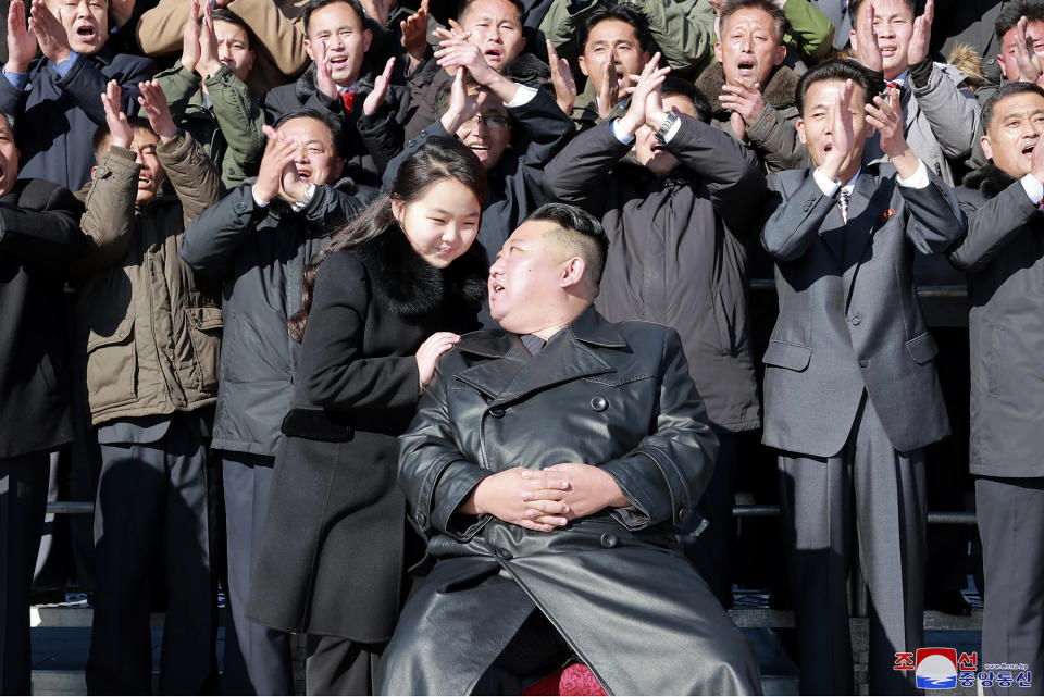 This undated photo provided on Nov. 27, 2022, by the North Korean government shows North Korean leader Kim Jong Un, center right, with his daughter, center left, pose with scientists and workers for a photo, following the launch of what it says a Hwasong-17 intercontinental ballistic missile, at an unidentified location in North Korea. Independent journalists were not given access to cover the event depicted in this image distributed by the North Korean government. The content of this image is as provided and cannot be independently verified. Korean language watermark on image as provided by source reads: "KCNA" which is the abbreviation for Korean Central News Agency. (Korean Central News Agency/Korea News Service via AP)
