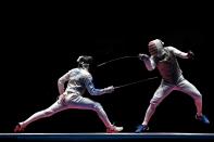 <p>Daniele Garozzo of Italy competes against Gerek Meinhardt of the United States during the Men’s Foil Team Bronze Medal Match bout on Day 7 of the Rio 2016 Olympic Games at Carioca Arena 3 on August 12, 2016 in Rio de Janeiro, Brazil. (Getty) </p>