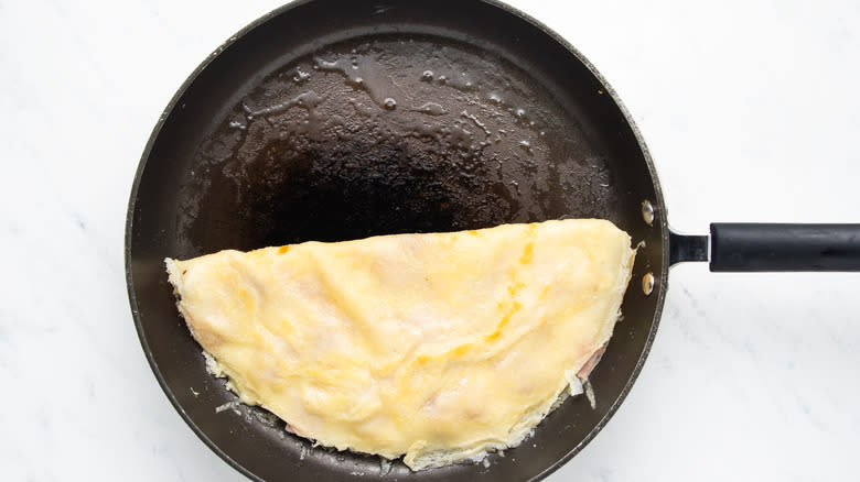 folded crepe in frying pan