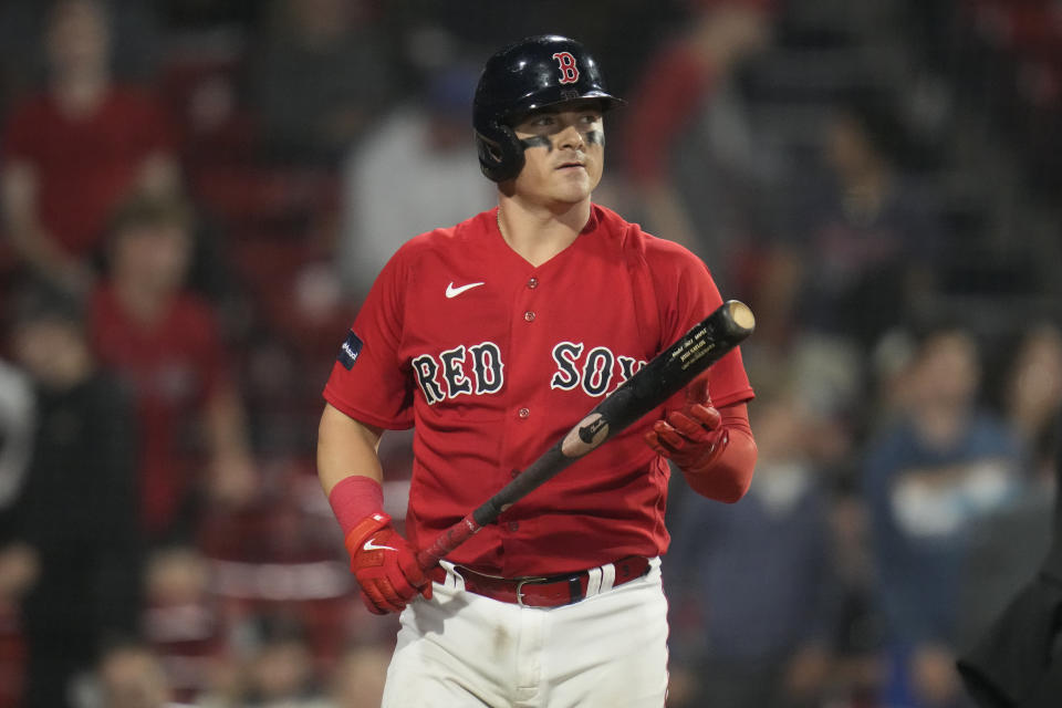 Boston Red Sox's Reese McGuire heads back to the dugout after striking out to end the baseball game against the Colorado Rockies at Fenway Park, Tuesday, June 13, 2023, in Boston. The Rockies won 7-6. (AP Photo/Charles Krupa)