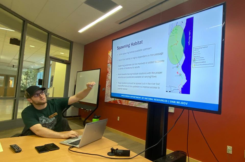 Aaron Schiller, fisheries biologist with the Wisconsin Department of Natural Resources, shows a map of potential lake sturgeon spawning habitat in the Milwaukee River at a May 1 meeting in Milwaukee.