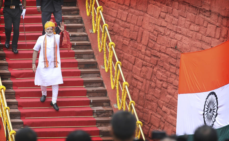 Indian Prime Minister Narendra Modi waves as he leaves after addressing the nation on the country's Independence Day from the ramparts of the historical Red Fort in New Delhi, India, Thursday, Aug. 15, 2019. Modi said that stripping the disputed Kashmir region of its statehood and special constitutional provisions has helped unify the country. Modi gave the annual Independence Day address from the historic Red Fort in New Delhi as an unprecedented security lockdown kept people in Indian-administered Kashmir indoors for an eleventh day. (AP Photo/Manish Swarup)