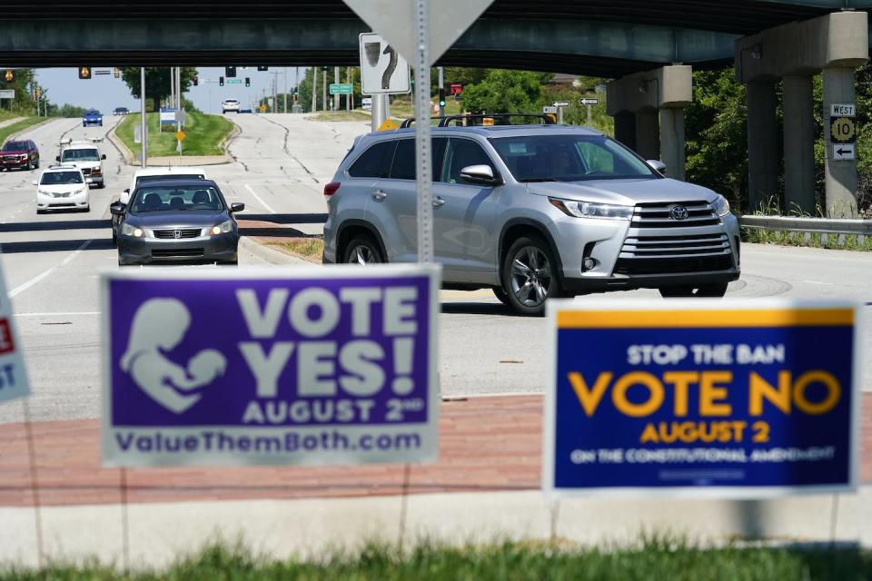 Signs supporting and opposing a Kansas constitutional amendment on abortion are displayed on Kansas 10 Highway. <a href="https://www.gettyimages.com/detail/news-photo/signs-in-favor-and-against-the-kansas-constitutional-news-photo/1412308440?adppopup=true" rel="nofollow noopener" target="_blank" data-ylk="slk:Kyle Rivas/Getty Images News via Getty Images North America;elm:context_link;itc:0;sec:content-canvas" class="link ">Kyle Rivas/Getty Images News via Getty Images North America</a>