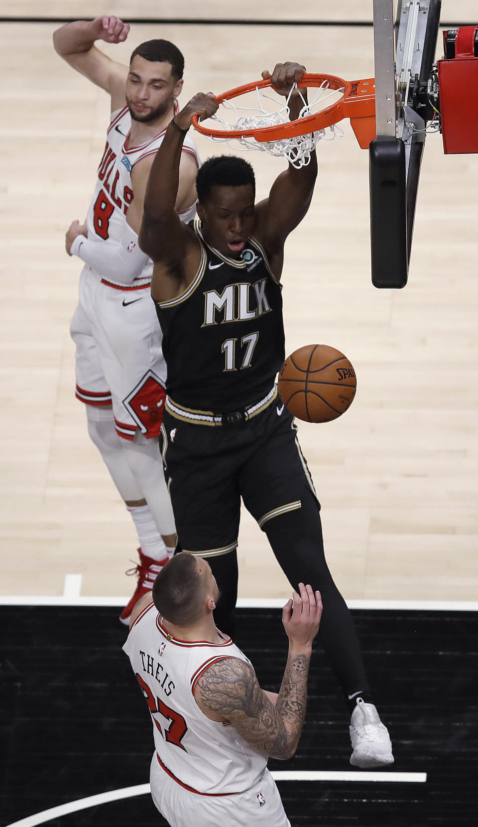 Atlanta Hawks' Onyeka Okongwu (17) scores past Chicago Bulls' Zach LaVine (8) during the first half of an NBA basketball game Friday, April 9, 2021, in Atlanta. (AP Photo/Ben Margot)