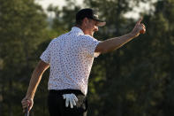 Justin Rose, of England, reacts after a birdie on the 18th green during the final round of the Masters golf tournament on Sunday, April 11, 2021, in Augusta, Ga. (AP Photo/David J. Phillip)