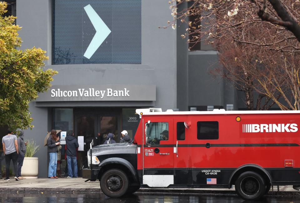 A Brinks armored truck sits parked in front of the shuttered Silicon Valley Bank (SVB) headquarters on March 10, 2023 in Santa Clara, California.