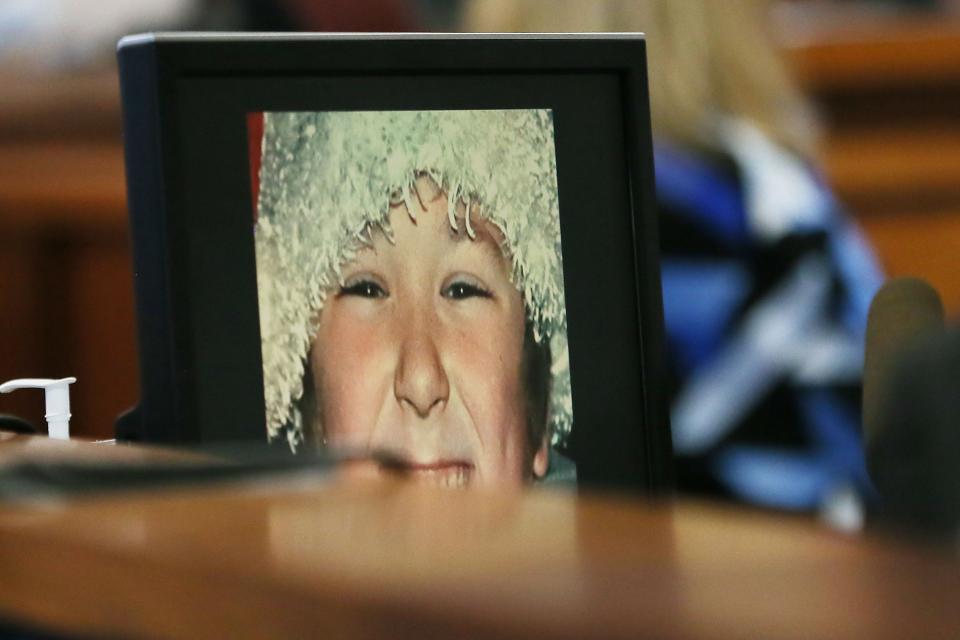 A photo of Jesse Lewis, Sandy Hook shooting victim, is displayed while his mom Scarlett Lewis testifies Tuesday Aug. 2, 2022, at Travis County Courthouse in Austin. Alex Jones has been found to have defamed the parents of a Sandy Hook student for calling the attack a hoax.